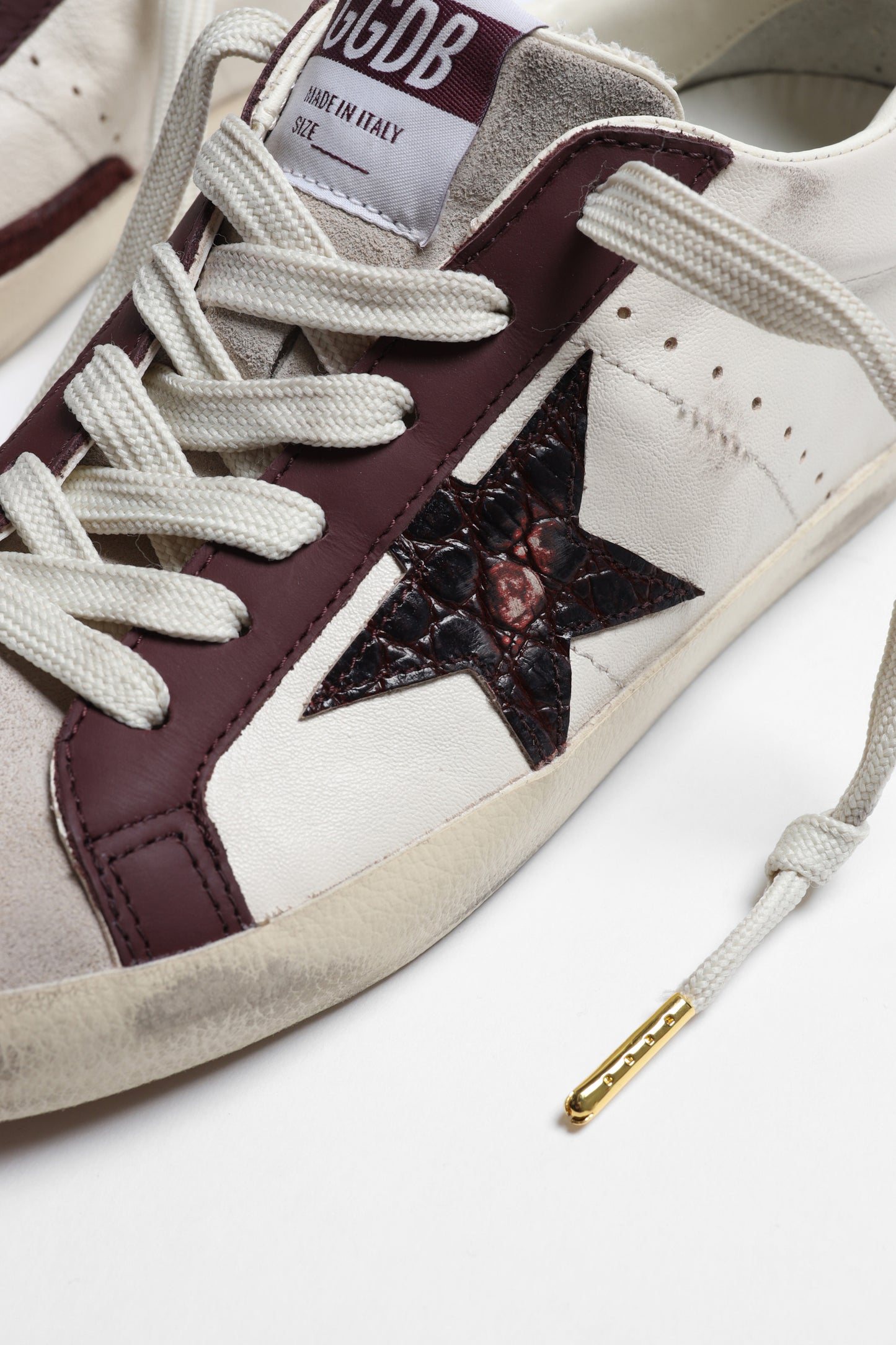 Sneaker Super Star in Butter/Burgundy Golden Goose